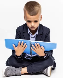 Boy with book in his lap